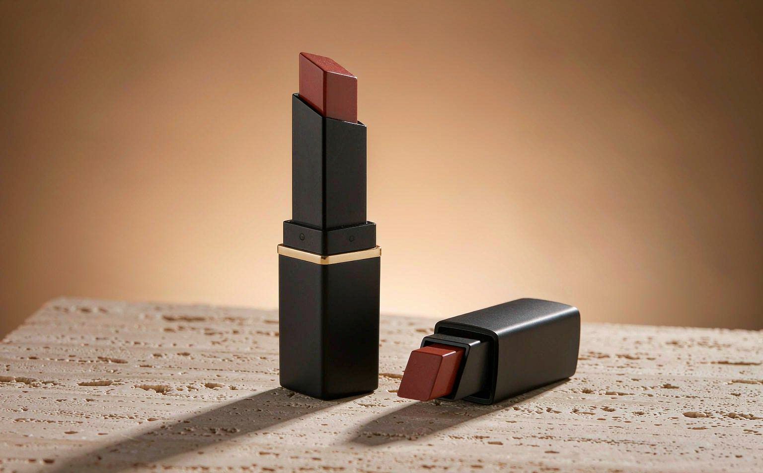 Luxury lipstick case in matte black with a champagne gold waist ring